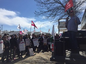 Rick Ostlund, a Sasktel employee and for UNIFOR member speaks at rally in front of Finance Minister Kevin Doherty's MLA office. The rally was held by the Saskatchewan Federation of Labour in protest of Bill 40 and the cuts the Saskatchewan Party has been making. PHOTO ASHLEY ROBINSON