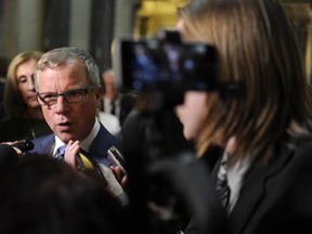 Premier Brad Wall speaks with members of the media following the 2017 budget speech at the Legislative Building in Regina Wednesday, March 22, 2017.