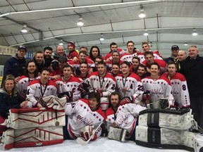 The Extreme Hockey Regina Capitals celebrate a bronze-medal win on Sunday at the Keystone Cup in Arborg, Man.