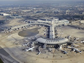 The immense size of today's modern Toronto-Pearson International Airport becomes obvious in Mike Mahovlich' s remarkable aerial photo forwarded to me courtesy the GTAA. Note the dark outline of the old (1964) Aeroquay structure still visible on the tarmac between Piers E and F of Terminal 1 (opened 2007).  For Mike Filey The Way We Were Column on March 16, 2014. ORG XMIT: POS1610072059218641