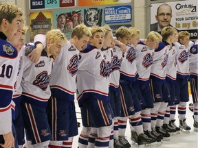 The Regina Pat Canadians celebrate after winning the Telus Cup west regional qualifier on Sunday in Steinbach, Man.
