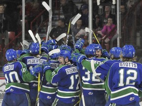 The Swift Current Broncos celebrate after their series-clinching, 3-2 victory over the Moose Jaw Warriors on Monday at Mosaic Place.