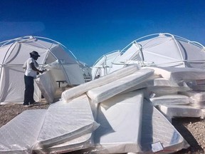 This photo provided by Jake Strang shows mattress and tents set up for attendees of the Fyre Festival, Friday, April 28, 2017 in the Exuma islands, Bahamas. Organizers of the much-hyped music festival in the Bahamas canceled the weekend event at the last minute Friday after many people had already arrived and spent thousands of dollars on tickets and travel. A statement cited &ampquot;circumstances out of our control,&ampquot; for their inability to prepare the &ampquot;physical infrastructure&ampquot; for the event in the lar