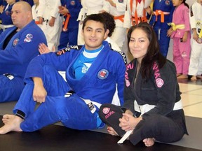 Andrew Pasap and his cousin Shana Pasapa at a martial arts competition.