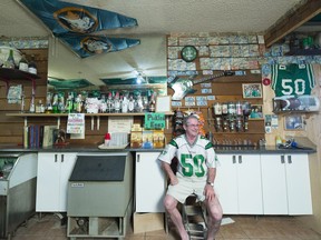 Lyle Hodgins sits behind the bar at the Aylesbury Hotel.