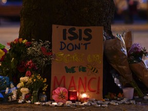 Messages and floral tributes are seen in Albert Square in Manchester, northwest England on May 23, 2017, in solidarity with those killed and injured in the May 22 terror attack at the Ariana Grande concert at the Manchester Arena.