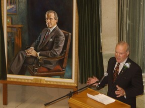 Former Saskatchewan premier Grant Devine addresses an audience at the Legislative Building in Regina in 2005 after the unveiling of his official portrait.