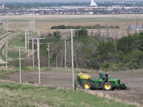 A farmer seeds his crop east of Saskatoon in 2013.