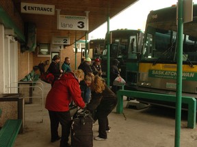 Passengers board buses at the former STC terminal at 2041 Hamilton Street in 2006.