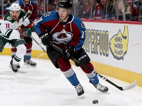 DENVER, CO - APRIL 06:  Tyson Jost #27 of the Colorado Avalanche brings the puck out from behind the goal while playing the Minnesota Wild at the Pepsi Center on April 6, 2017 in Denver, Colorado.