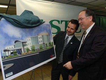 Saskatchewan Agriculture minister Mark Wartman (right) and Regina Mayor Pat Fiacco look over an exterior drawing of the  Saskatchewan Transportation Corporation (STC) Bus Depot in 2005.