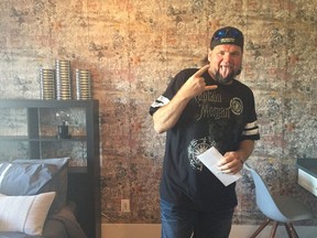 An excited Derrick Fink, winner of the Hospitals of Regina Foundation's Home Lottery $1.4 million grand prize showhome, poses in one of his new bedrooms.