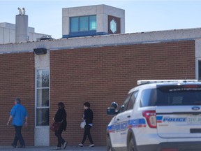 A police vehicle sits parked outside of Beth Jacob Synagogue.