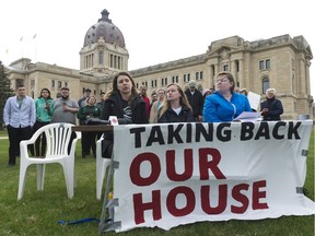 Anne-Marie Roy of the Canadian Federation of Students, center left, speaks while Students Mobilizing Against Cuts organizers Kelsey Morrison, center right, and Emily Barber, right, look on at a the Legislative Building. The student organization said they'd organize five days of action to protest the recent provincial cuts to post-secondary education.