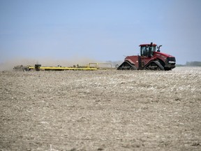 A farmer works his field approximately 10 kilometres north of Regina.