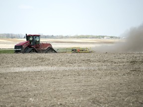 A farmer works his field approximately 10 kilometres north of Regina.