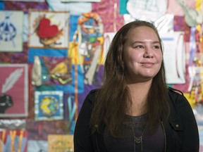 Leanndra Davidson, a Grade 12 student from Balfour Collegiate, stands in front of The Ribbon Project. Students created cloth creative pieces to promote reconciliation.