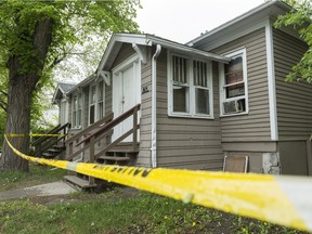 Police tape surrounds a house on the 1400 block of 12th Avenue.