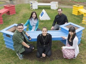 Scott Collegiate students Miles McCallum, Alexandria Allary, and Justine Lonechild, bottom from left, and principal Danette Exner, top left, and teacher Ian Temple, top right, pose at an Angels Corner. The space is meant to raise awareness and commemorate female victims of violence and abuse.