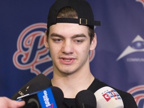 Regina Pats defenceman Chase Harrison speaks to media outside the team's dressing room for the final time.