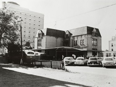 A photo of the Provincial Archives of Saskatchewan Photograph No. 57-157-02, which shows the rear of the S.T.C. bus depot in Regina in June 1957. The first depot was located in a renovated St. Mary's School, at Scarth Street and Victoria Avenue.