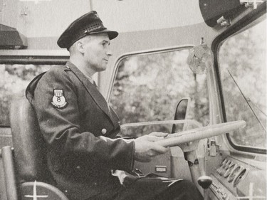 A photo of the Provincial Archives of Saskatchewan Photograph No. 55-240-01, that says "Bus driver, Raymond Earl, at the wheel of a Saskatchewan Transportation Company bus" taken Sept. 1955.
