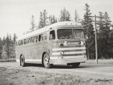 A photo of the Provincial Archives of Saskatchewan Photograph No. 54-023-35, that says "A Saskatchewan Transportation Company bus heads for Lac La Ronge" taken May 1954.