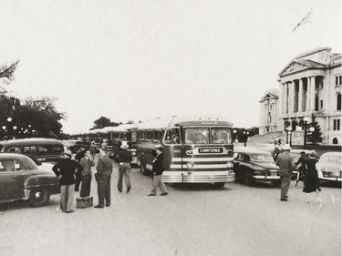 A photo of the Provincial Archives of Saskatchewan Photograph No. 54-063-01, that says "Chartered Saskatchewan Transportation Company bus line up, in front of the Legislative Building, Regina" taken June 1954.