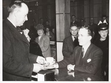 A photo of the Provincial Archives of Saskatchewan Photograph No. 2527, that says "Opening of Bus Depot Cafe. Premier Douglas being served cup of java." The server is John Taylor Douglas, then Minister of Highways and Transportation. It's believed the photo is circa 1950.