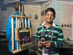 REGINA, SASK : May 18, 2017 - Tharindu Kottegoda, left, stands with his Energy Harnessing Backback at the Canada-Wide Science Fair held at the University of Regina. MICHAEL BELL / Regina Leader-Post.