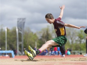 Tommy Avram lands in the pit during the midget boys long jump at the Regina High Schools Athletic Association track and field championships, which concluded Thursday at the Canada Games Athletics Complex.