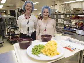 Heather Tulloch, left,  coordinator of nutrition and dietetic practice, and Stephanie Cook, director of Nutrition and Food Services, stand behind a  tray of lunch being served Monday at the Pasqua Hospital.