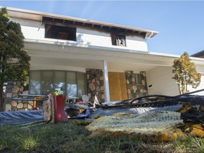 Items lay on the lawn of a fire damaged home at 142 Winfield Road.