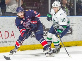 The Regina Pats' Connor Hobbs, 44, handles the puck with the Seattle Thunderbirds' Sami Moilanen in pursuit during Game 4 of the WHL's championship series on Wednesday in Kent, Wash.