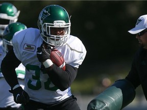 Running back Cameron Marshall performs a drill at the Riders' training camp in Saskatoon.