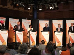Candidates (left to right) Jagmeet Singh, Guy Caron, Niki Ashton, Charlie Angus, Pat Stogran and Peter Julian listen to questions at the federal NDP leadership race debate in Sudbury, Ont. on Sunday May 28, 2017.