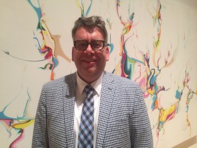 Anthony Kiendl, executive director and CEO of the Mackenzie Art Gallery poses in front of an Alex Janvier painting on exhibit at the gallery. The gallery received a $1.6 million grant from the South Saskatchewan Community Foundation, which was made possible by an anonymous donor.