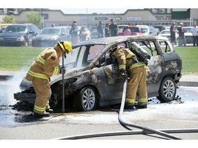 REGINA, SASK :  June 21, 2017  -- The Regina Fire & Protective Services along with the Regina Police Service were on the scene of a vehicle fire in the middle of Quance Street just  west of University Park Drive in Regina. TROY FLEECE / Regina Leader-Post
TROY FLEECE, Regina Leader-Post