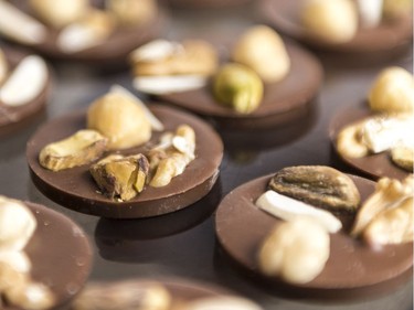 Medallion Milk chocolates with pistachio, almond, walnut and hazelnut.