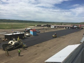 Workers were busy Tuesday paving the Main St. area of the Country Thunder Saskatchewan site in Craven.