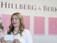 CEO and founder Rachel Mielke holds a colour balance card before giving an interview during an open house that celebrates Hillberg & Berk's new 31,000-square-foot headquarters.