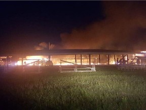 Kawacatoose First Nation community members estimate half of a large arbour, which held an announcer's stand and provided shelter during powwows, is damaged after parts of the structure burnt down after 9 p.m. on Sunday.