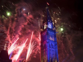Fireworks explode over the Peace Tower during the evening ceremonies of Canada's 150th anniversary of Confederation, in Ottawa on Saturday, July 1, 2017. THE CANADIAN PRESS/Justin Tang ORG XMIT: JDT132