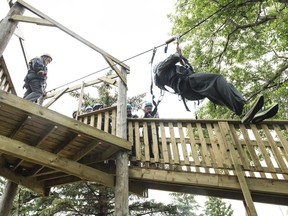 A group zip lines at Outer Edge Adventure Park.