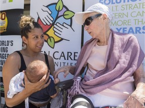 Edna McPherson, right, talks to five-week-old Pierce Craig's mother Ashley at an Eden Care Communities event celebrating Intergenerational Day held at Regina Lutheran Home.