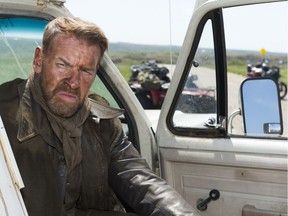 Actor Jay Reso poses at a truck on the set of SuperGrid, north of Regina.