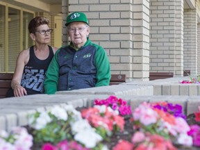 Bev Hartnell, left, sits with her 85-year-old father Bernard outside of the Santa Maria long-term care facility where he lives.