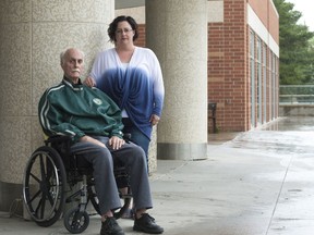 Nicole Dobson with her father Gerry Ennis, left, outside Wascana Rehab Centre, where he lives. Ennis, who has ALS, recently got a letter from the Ministry of Health indicating his rent would increase to $2,689 on July 1.