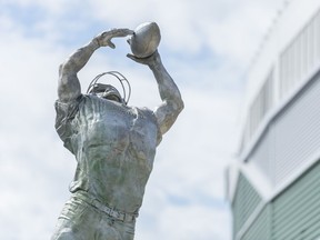 A new statue at its unveiling by the Saskatchewan Roughriders Football Club and City of Regina.