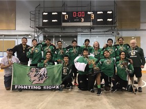 The Standing Buffalo Fighting Sioux celebrates after winning the Queen City Mixed Box Lacrosse midget boys title on Sunday.